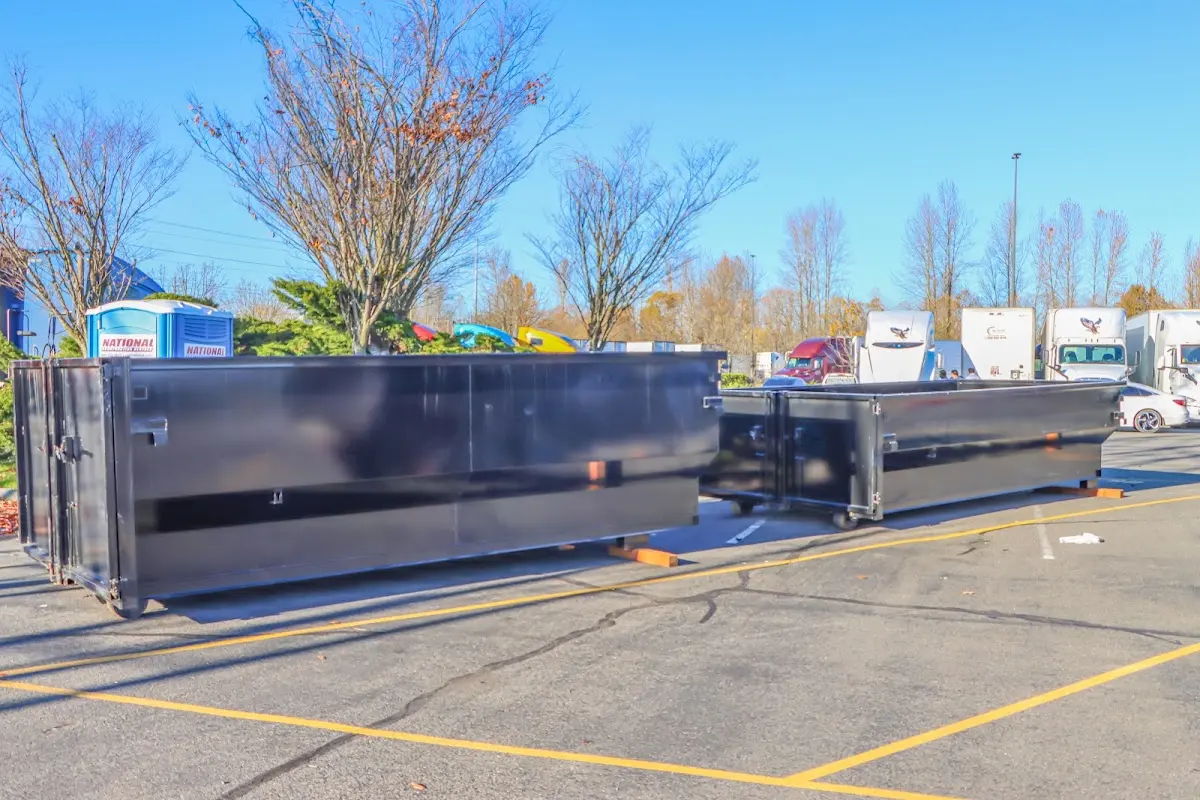 Professional dumpster rental service with roll-off container on residential driveway in La Habra Heights